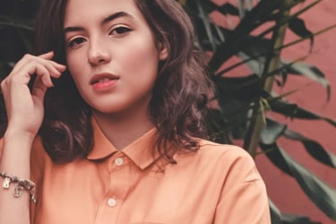 model posing with peach shirt